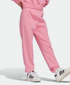 Women's Adidas Originals Adicolor Essentials Fleece Joggers Bliss Pink PINK 11 Women's Adidas Originals Adicolor Essentials Fleece Joggers Bliss Pink PINK -Women Shop HJ7864 5 APPAREL OnModel WalkingView grey